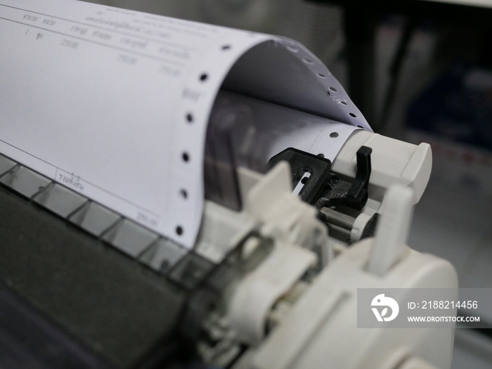 closeup of continuous paper printer in the office,selected focus.