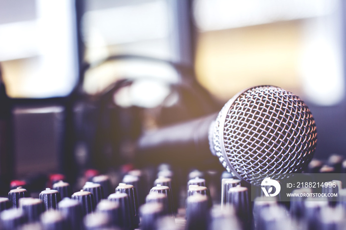 The microphone on the audio mixer. In the recording studio.