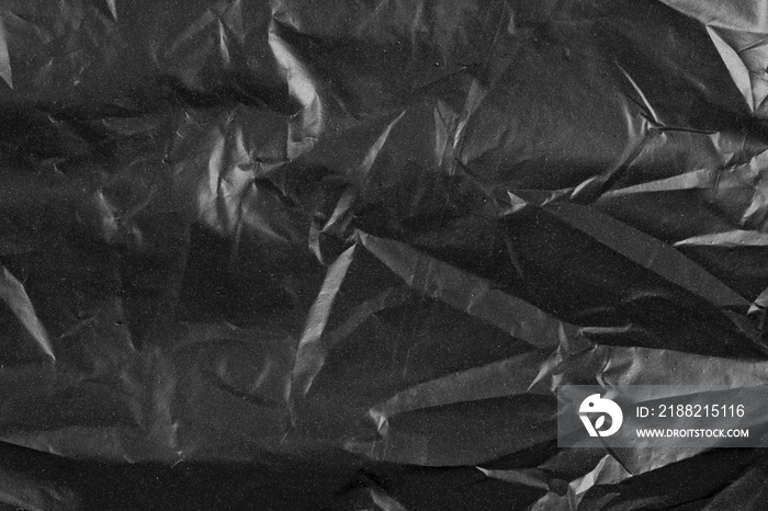 Abstract background crumpled plastic film texture black garbage bag