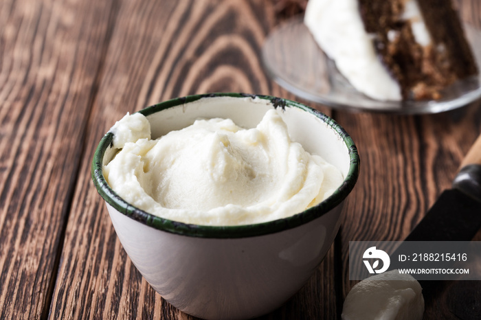 Homemade cream cheese frosting in rural mug