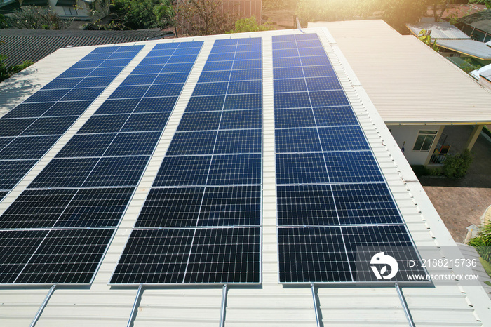 Solar panels installed on a roof of a large industrial building or a warehouse.