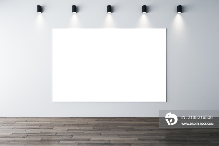 Minimalistic interior with lamps on ceiling and poster on wall.