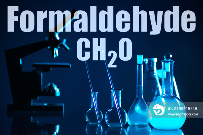 A scientist conducts an experiment in chemistry. Chemical test Chemical laboratory. Scientific research. A man in a white coat. A man with a pipette takes samples.