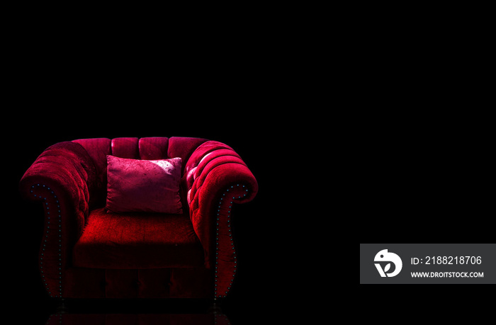 Sofa chair in low light, black background clipingpart