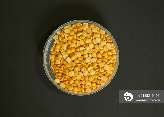 yellow toor dal for making dal tadka, Indian pulses isolated black background