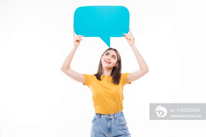 Portrait of a happy young woman holding empty speech bubble isolated over white background