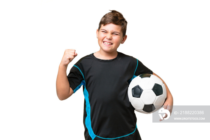 Little caucasian football player kid over isolated chroma key background celebrating a victory