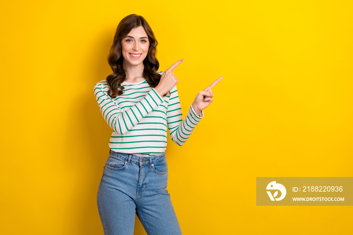 Photo of young optimistic charming pretty student university attractive lady indicate fingers mockup promo isolated on yellow color background