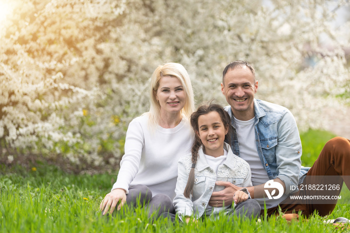 Happy family having picnic in nature. Smiling family picnicking in the park. spring nature