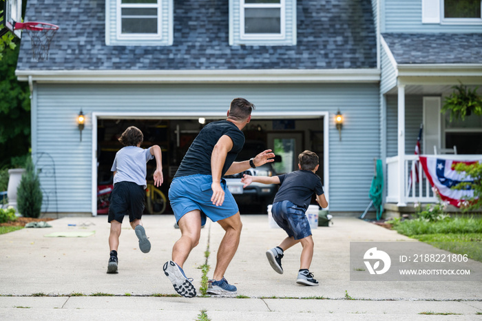 Air Force service member trains with his sons in a morning workout in preperation for a PT fitness test.