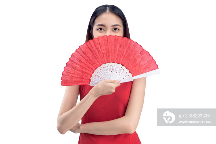 Asian Chinese woman in a cheongsam dress holding fan