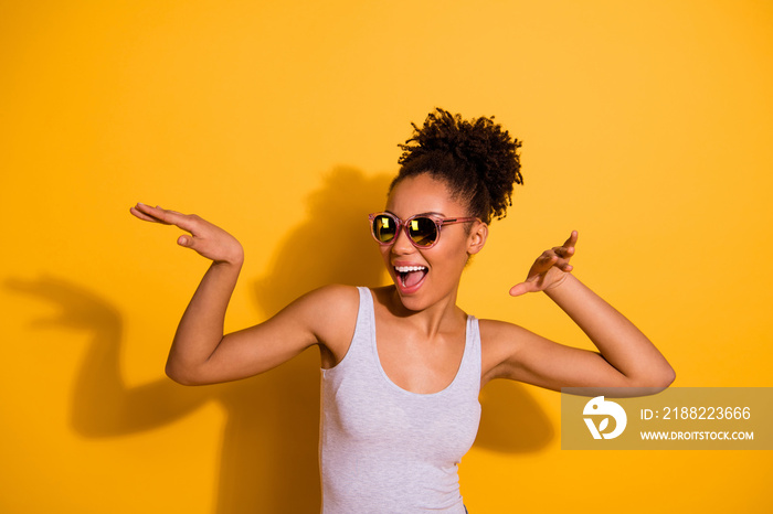 Close up photo beautiful nice pretty she her dark skin lady summer weekend rest relax dancing festive vacation fest modern moves motion wear sun specs casual tank-top isolated bright yellow background