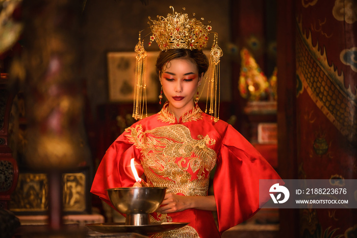 portrait of asian woman in traditional Chinese dress in Chinese shrine