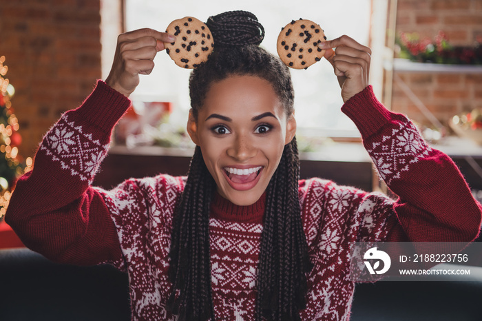 Photo of funny crazy lady make cookie mickey mouse ears have x-mas fun wear jumper in decorated home indoors