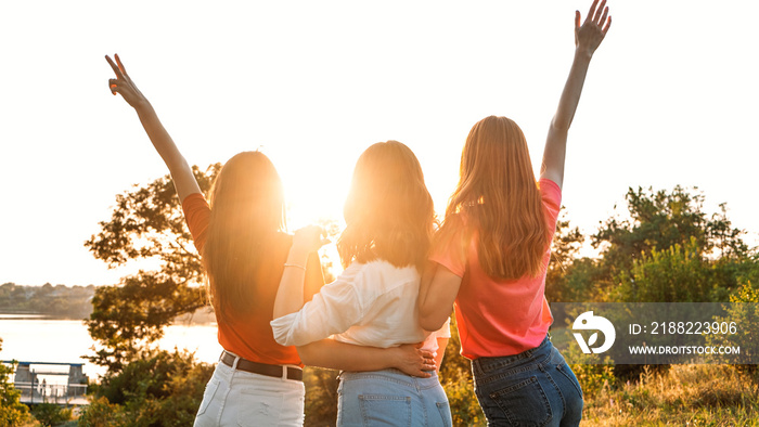 International Womens Day. Women, Female, Feminism, Friends, Girl power, diversity, femininity Concept. Group of three happy young women having fun outdoor