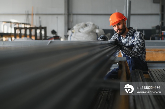 Man chooses metal profile for construction in Factory