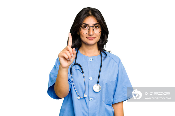 Young nurse Indian woman isolated showing number one with finger.