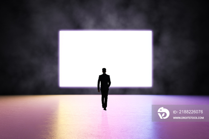 Future concept with man silhouette heading to blank white screen in glowing purple led frame on dark wall in empty presentation room with glossy floor in pink shades. Mockup