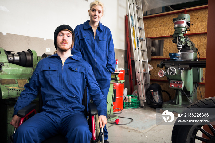 Young Mechanics Apprentices In A Workshop