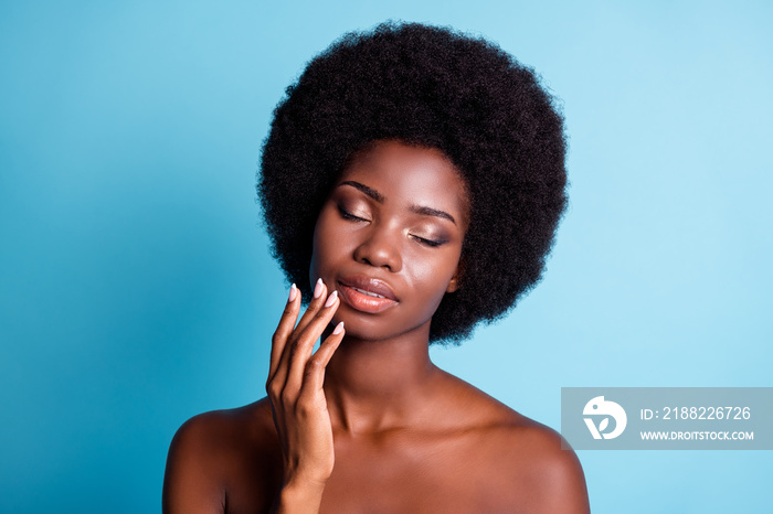 Closeup headshot photo of dark skin big volume hairstyle charming pretty woman eyes closed hand lips preparing clean makeup well-being concept naked isolated blue color background