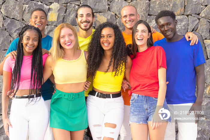 Happy friends from diverse cultures and races looking at camera. Students having fun at erasmus university. Youth, tech and friendship concept. Image