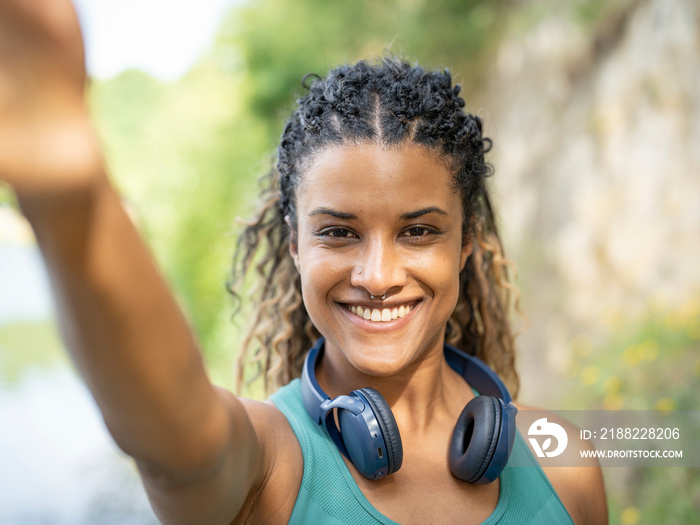 Portrait of smiling woman wearing headphones