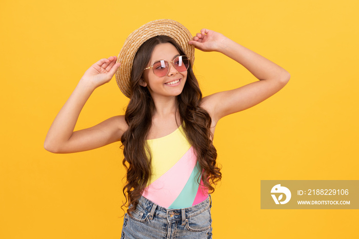 summer portrait. summer party look. happy funny kid in eyeglasses and straw hat.