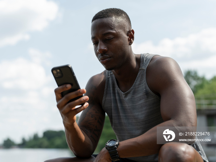 Man using smart phone outdoors