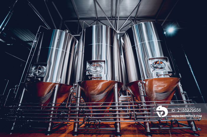 Rows of steel tanks for beer fermentation and maturation in a craft brewery