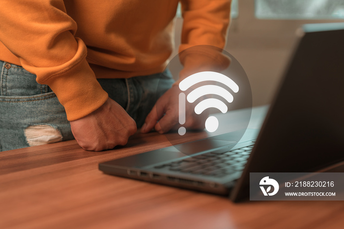 Man using a computer laptop to connect to wifi but wifi not connected, and waiting to loading digital business data form website, concept technology of waiting for connect to wifi.