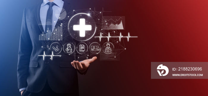 Businessman hold virtual plus medical network connection icons. Covid-19 pandemic develop people awareness and spread attention on their healthcare.Doctor,document,medicine,ambulance,patient icon.