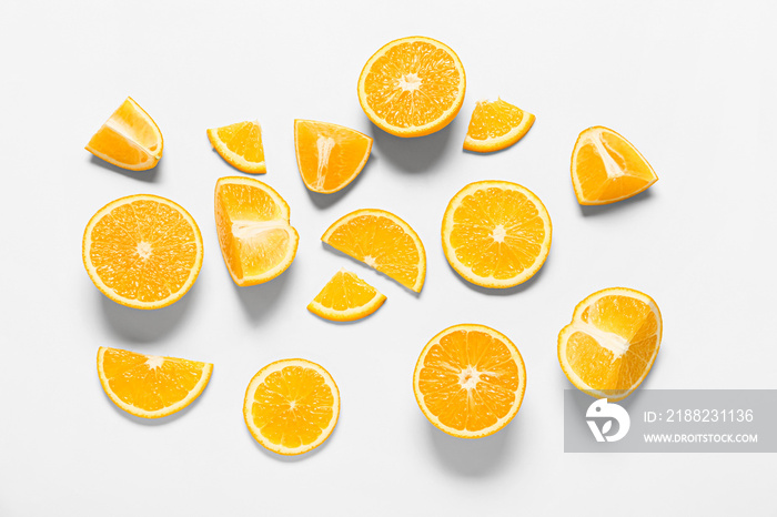 Tasty orange pieces on white background