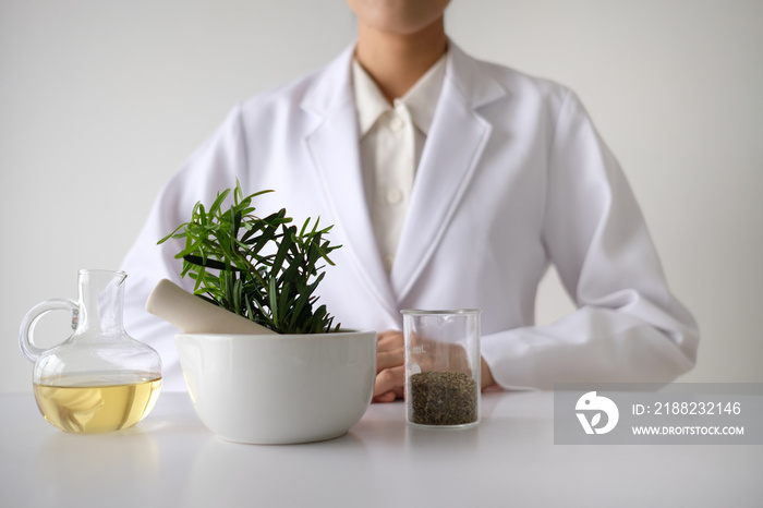 doctor woman scientist making herbal medicine.