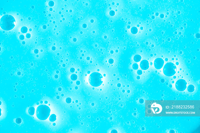 Bubble light blue background texture. Berry gel to cleanse the skin of the face and body. Spa treatments, skin care. Bath foam, detergent. Slime blue