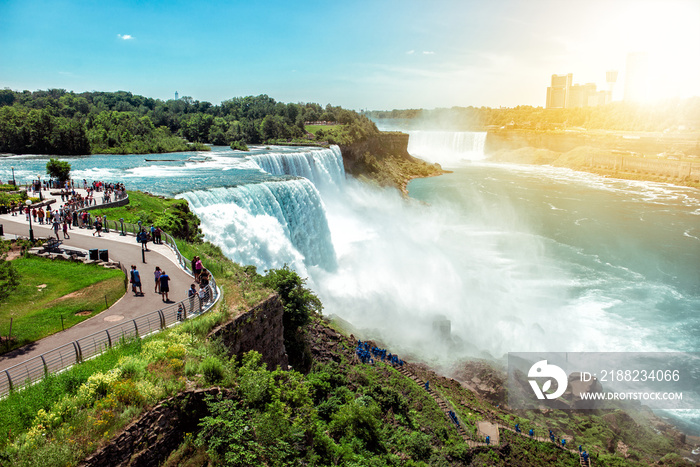 American side of Niagara falls, NY, USA. Tourists enjoying beautiful view to Niagara Falls during hot sunny summer day..