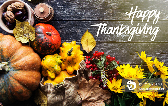 Happy Thanksgiving day concept - traditional holiday food with pumpkins on old wooden