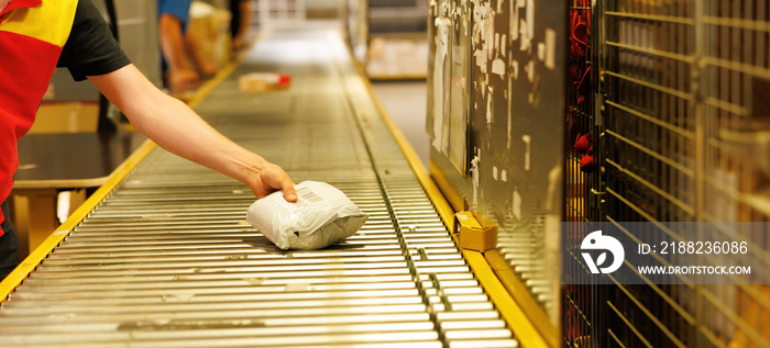 Warehouse worker working on a conveyor line