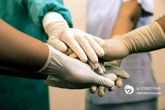 hands of doctor team stack after meeting consult with patient problem in hospital.