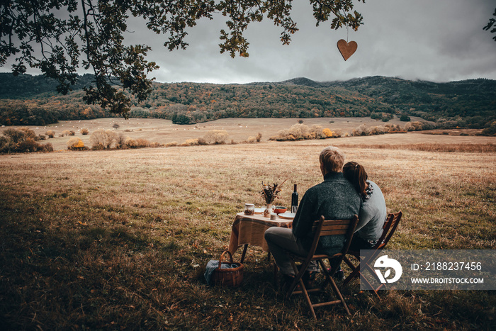 Vintage colored photo. Table prepared for lunch in autumn nature, picnic