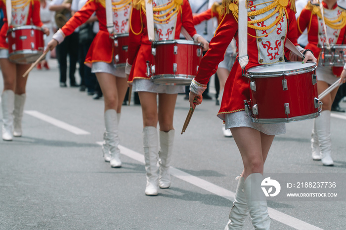 Young girls drummer at the parade. Street performance. Majorettes in the parade