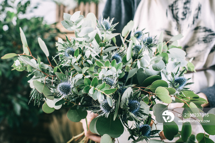 Florist shop with workplace on making flower bouquet