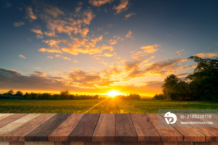 Rice field sunset and Empty wood table for product display and montage.