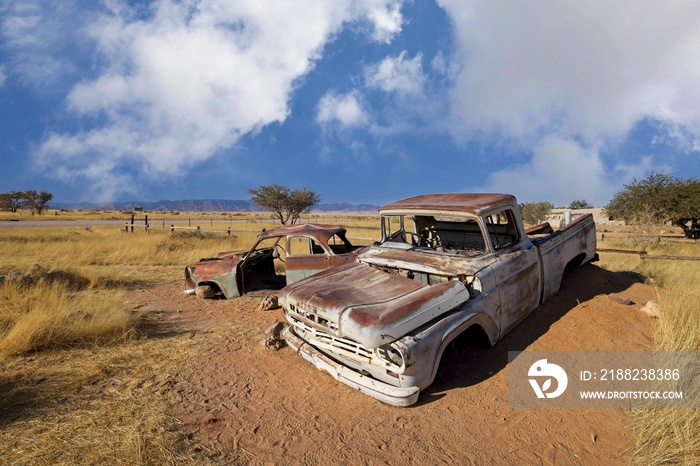 Abandoned car wrecks on the edge of desert Namib-Naukluft National Park in the Solitaire, Namibia