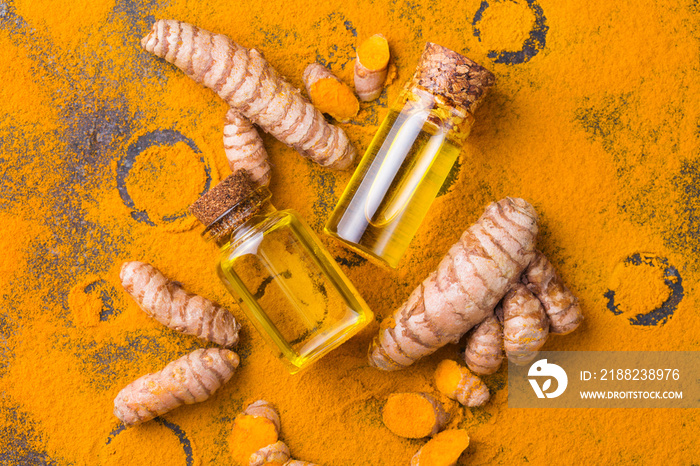 Turmeric essential oil, orange root and powder, beauty and spa