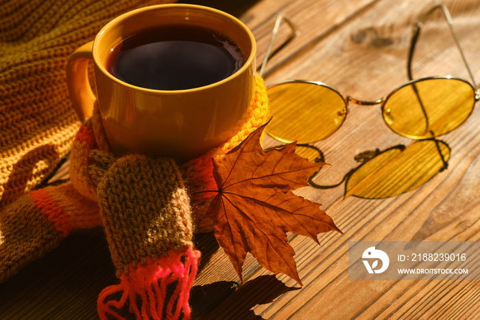 book with glasses, cup of coffee, autumn leaves, wool sweater