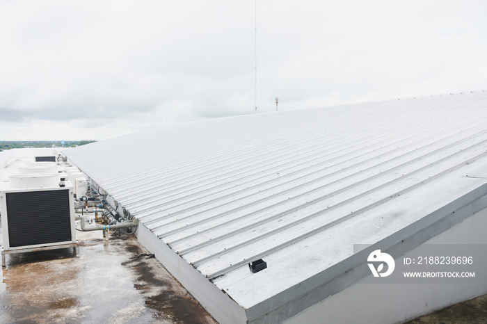 metal sheet roofing on commercial construction with blue sky