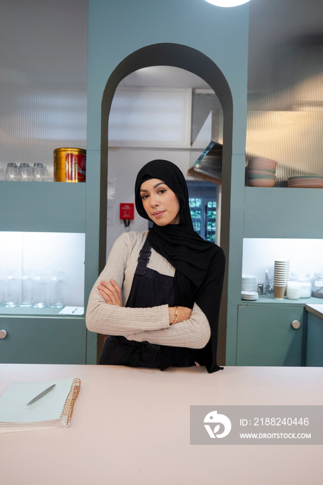 Portrait of female cafe owner at work