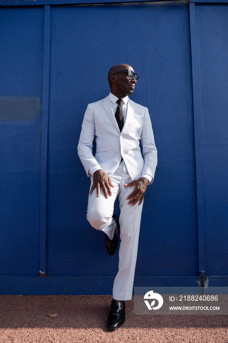 Confident man wearing white suit