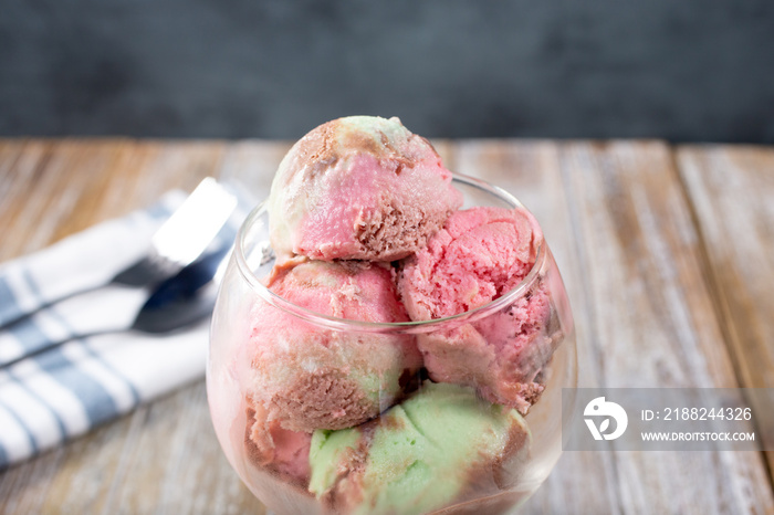 A view of a glass of spumoni ice cream scoops.