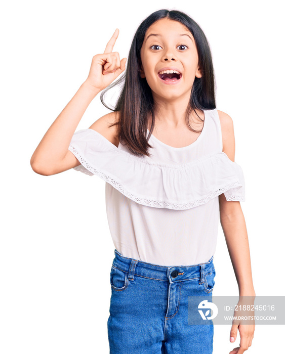 Beautiful child girl wearing casual clothes pointing finger up with successful idea. exited and happy. number one.